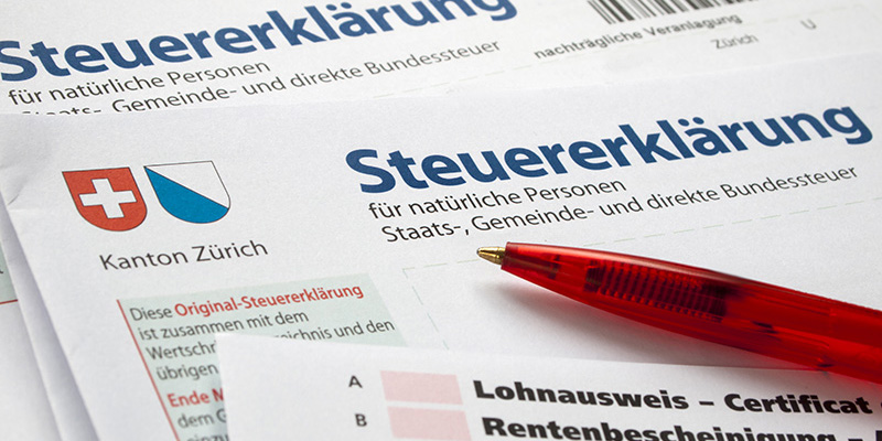 Close-up of swiss tax form with red pencil